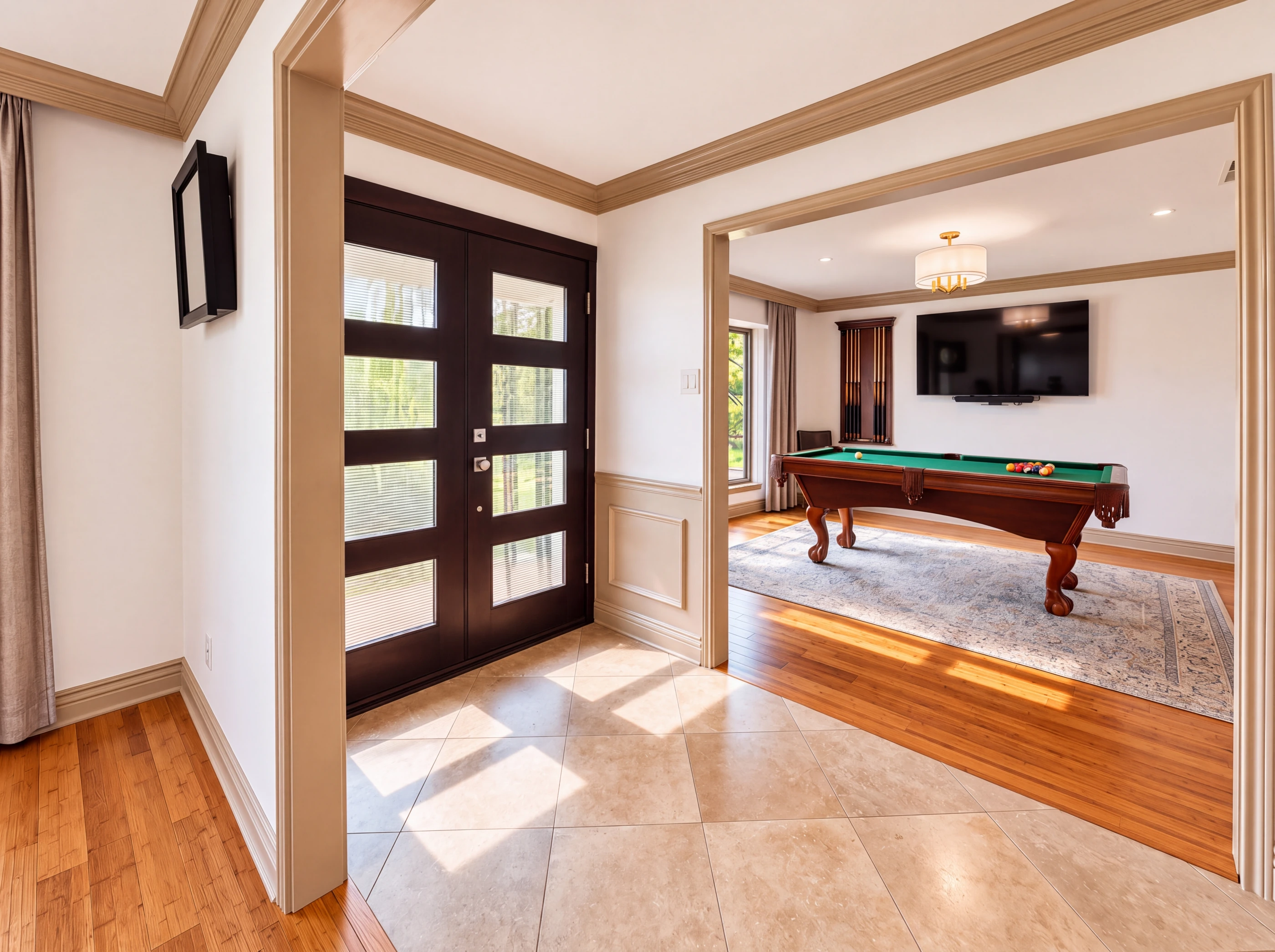 Black glass double doors, looking into the game room