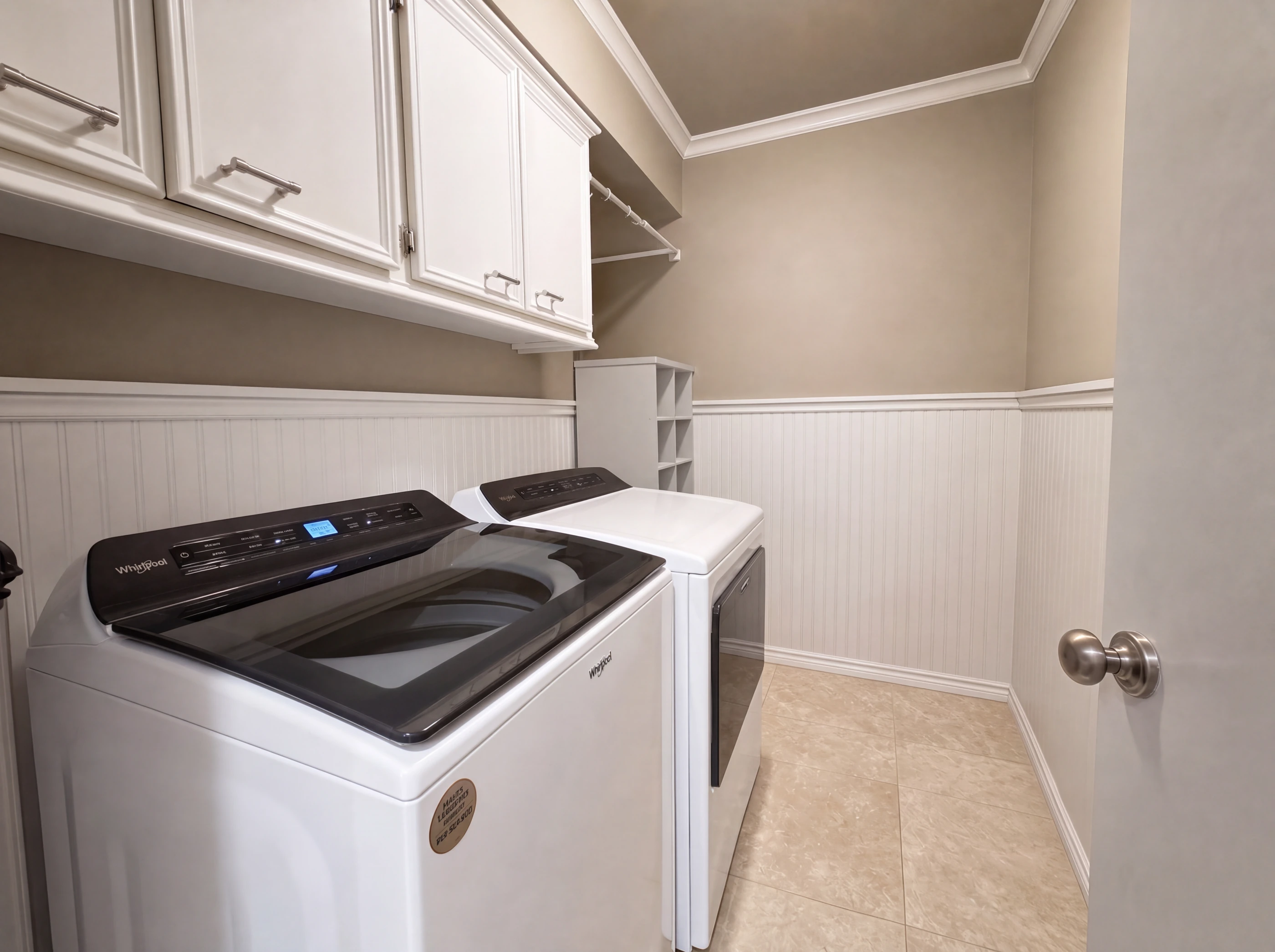 Utility room with built-in cabinetry